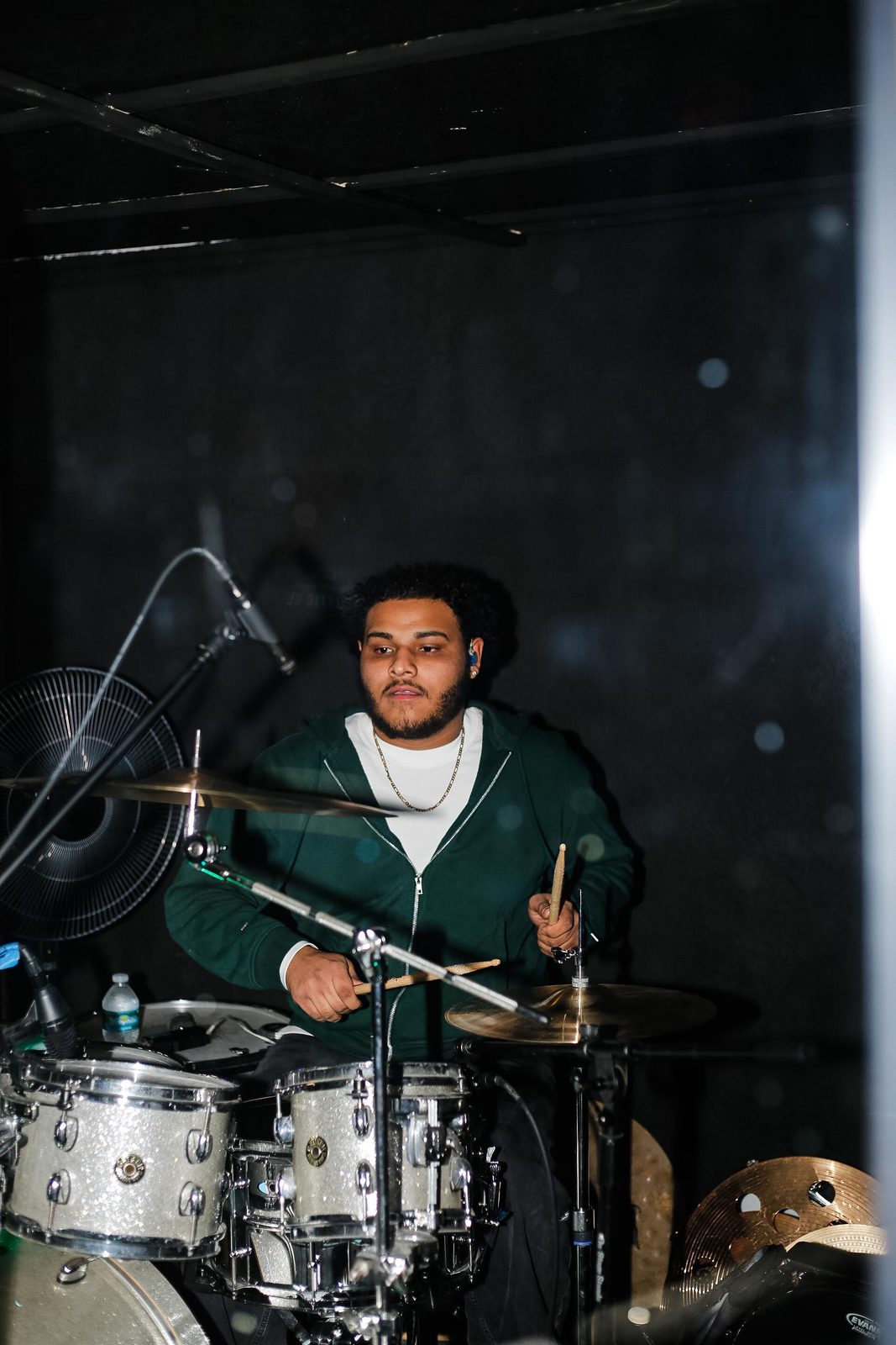 The QARA drummer behind the kit
